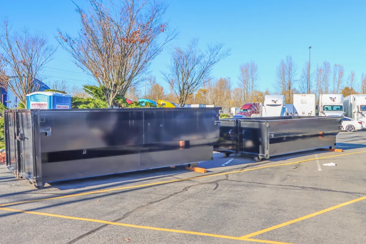 Professional dumpster rental service with roll-off container on residential driveway in Lithia Springs